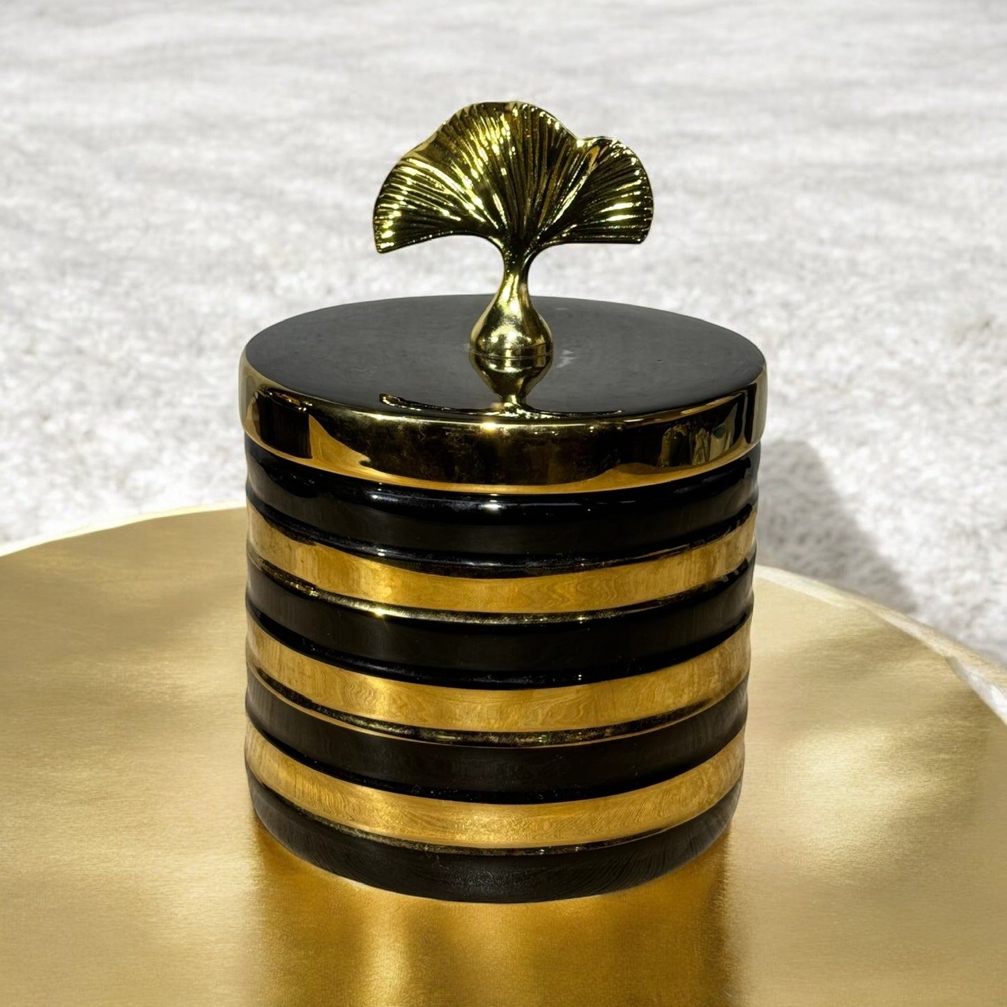 Black and Gold Striped Decorative Jar with Leaf Handle